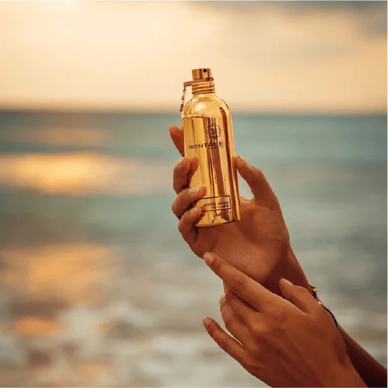Perfume bottle in hand