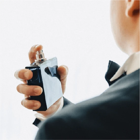 Perfume bottle in hand